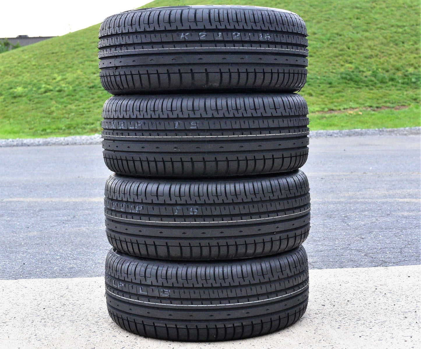 A pair of 2(2) 225/40R20 101W XL AS A/S performance tires